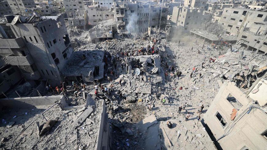 People check the rubble of buildings destroyed in an Israeli strike on the Bureij refugee camp in the central Gaza Strip on Nov. 2, 2023.