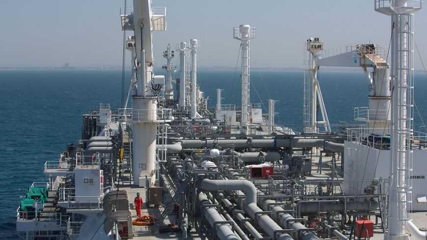 An employee walks on the Expedient regasification ship, anchored off the coast of Israel in the Mediterranean Sea on February 26, 2015, as natural gas began flowing from the vessel, hired by the Israel Electric Corporation, to its power stations. The ship, anchored about ten kilometres from the Hadera coast, was connected the previous week to the marine buoy and as of February 25, natural gas has begun flowing from the LNG (liquid natural gas) ship through an underwater pipeline directly to the company's po