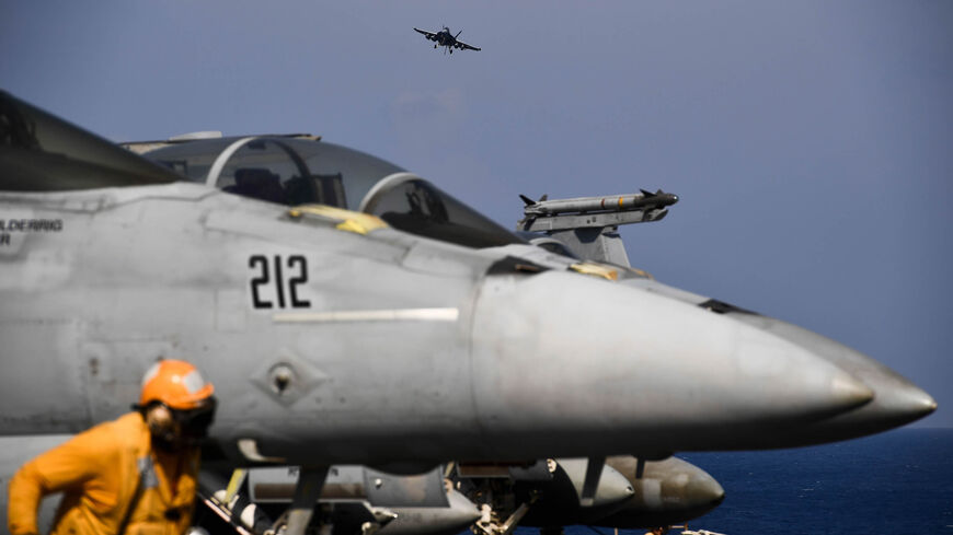 A F-18 Hornet fighter jet prepares to land on the deck of the US navy aircraft carrier USS Harry S. Truman in the eastern Mediterranean Sea, May 8, 2018.