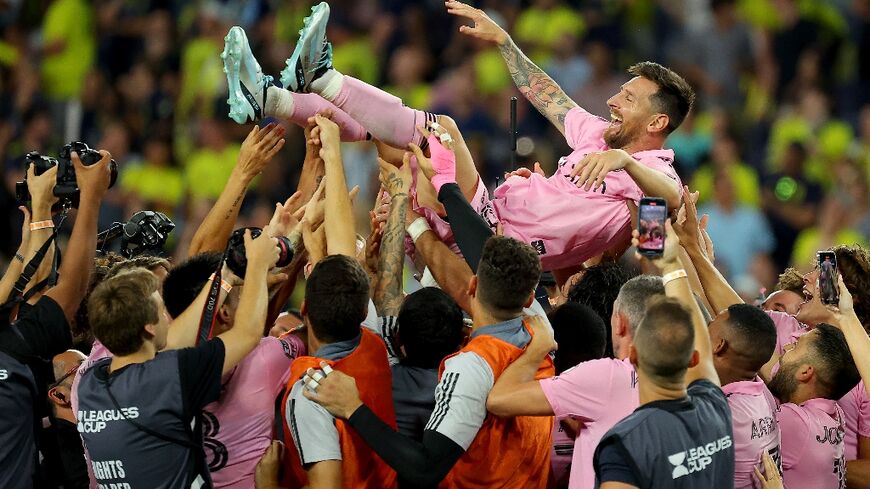 Lionel Messi is hoisted into the air by his Inter Miami teammates after winning the Leagues Cup final in August