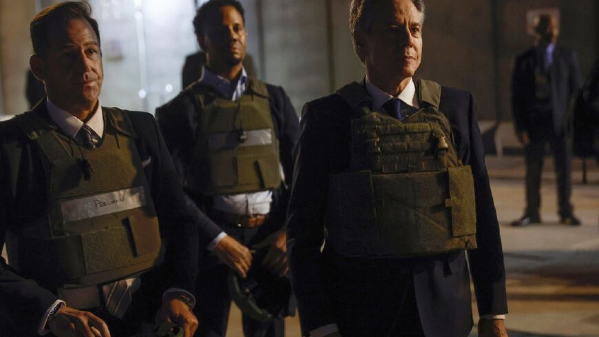 US Secretary of State Antony Blinken (R) after arriving in Baghdad