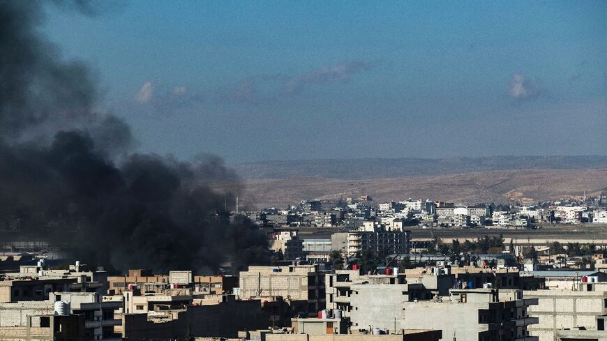 Smokes billows in Qamishli in northeastern Syria close to the Turkish border amid Turkish strikes