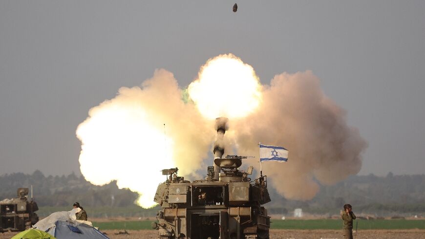 Israeli forces shell Gaza from the border area in southern Israel on December 12