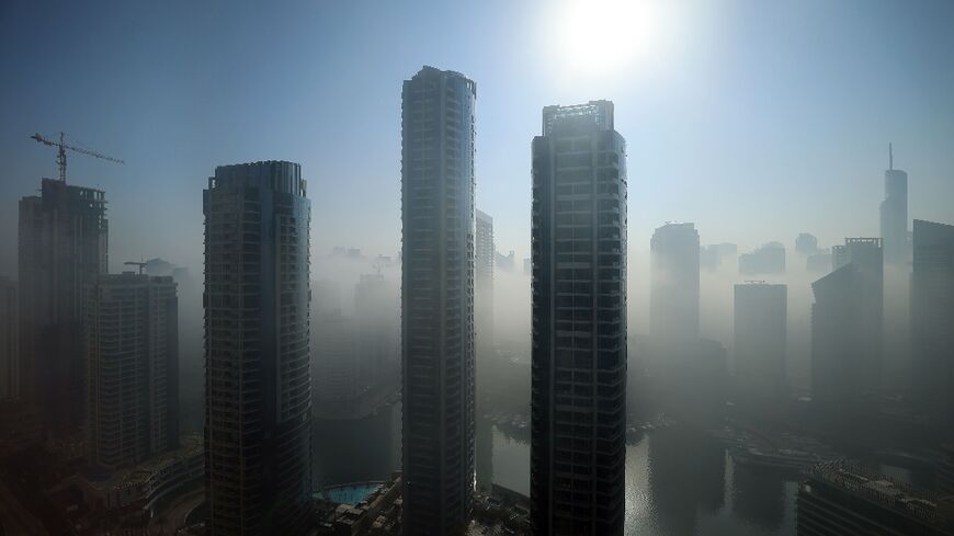 Skyscrapers amidst fog near Dubai Marina last year