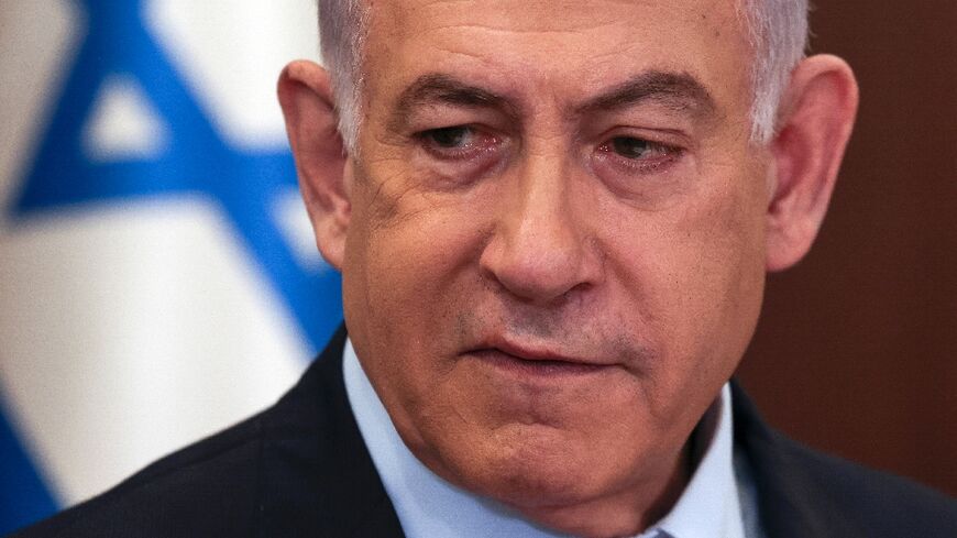 Israeli Prime Minister Benjamin Netanyahu heads the weekly cabinet meeting at his office in Jerusalem on December 10, 2023