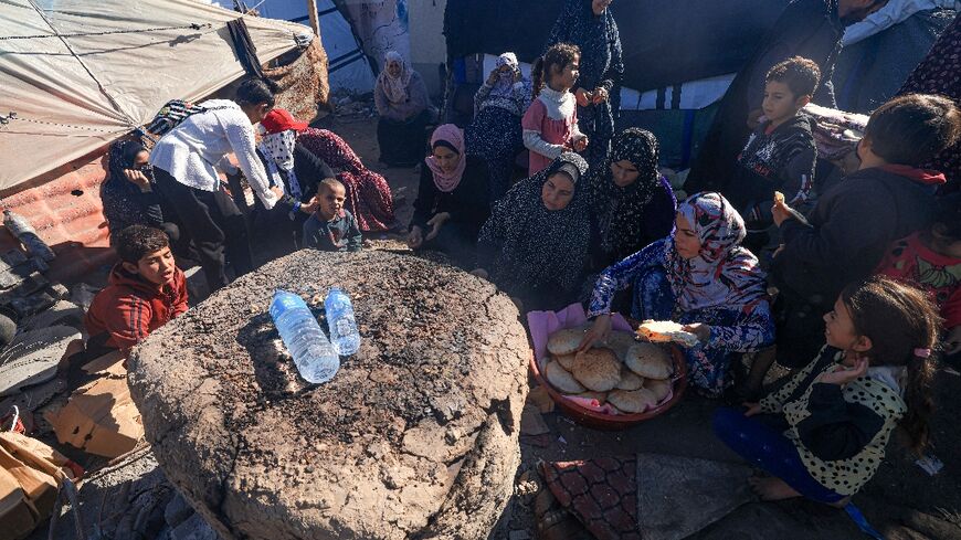 Makeshift bread ovens like this one in the central Gaza Strip have profilerated across the territory as Israel's punishing air and ground offensive has forced bakeries to close