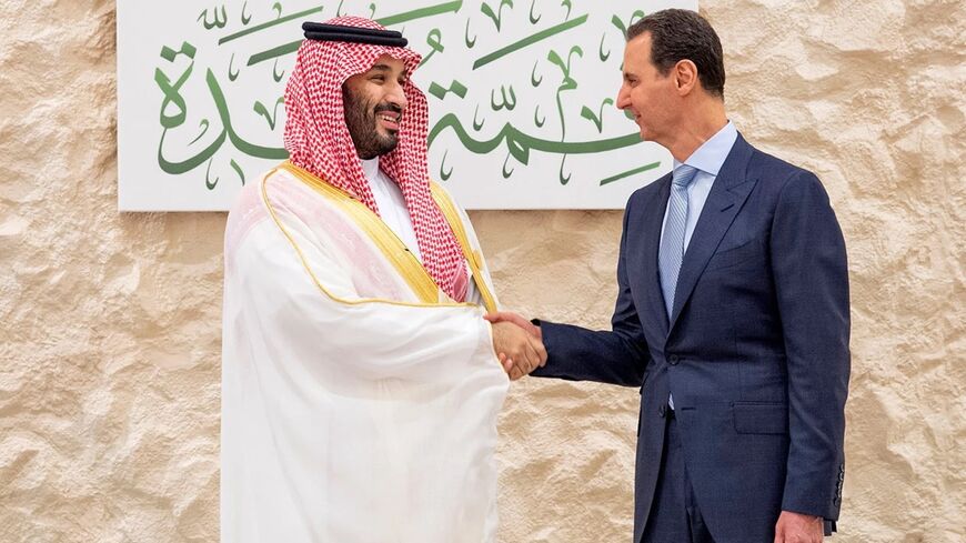Saudi Crown Prince Mohammed bin Salman greets Syrian President Bashar Assad during the Arab summit in Jeddah, Saudi Arabia, on Friday. Saudi Press Agency / Saudi Press Agency via AP
