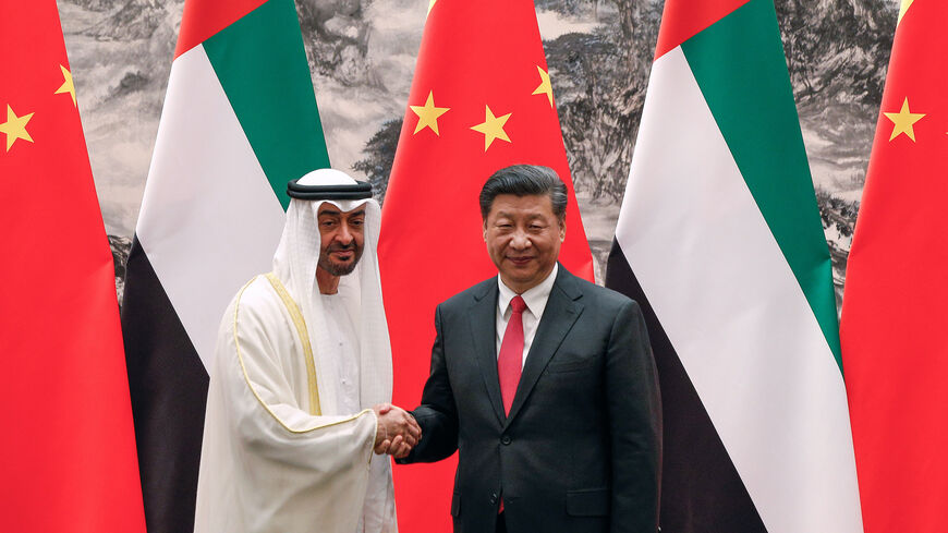 Abu Dhabi's crown prince, Sheikh Mohammed bin Zayed Al Nahyan, left, shakes hands with Chinese President Xi Jinping after witnessed a signing ceremony at the Great Hall of the People in Beijing, Monday, July 22, 2019.