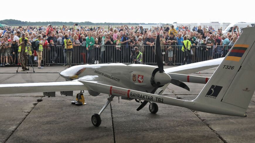 A Turkish Bayraktar TB2 combat drone is on view during a presentation at the Lithuanian Air Force Base in Siauliai, Lithuania, on July 6, 2022. 