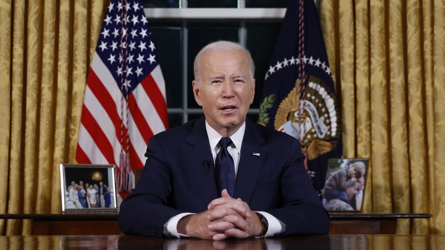 U.S. President Joe Biden addresses the nation from the Oval Office of the White House on October 19, 2023.