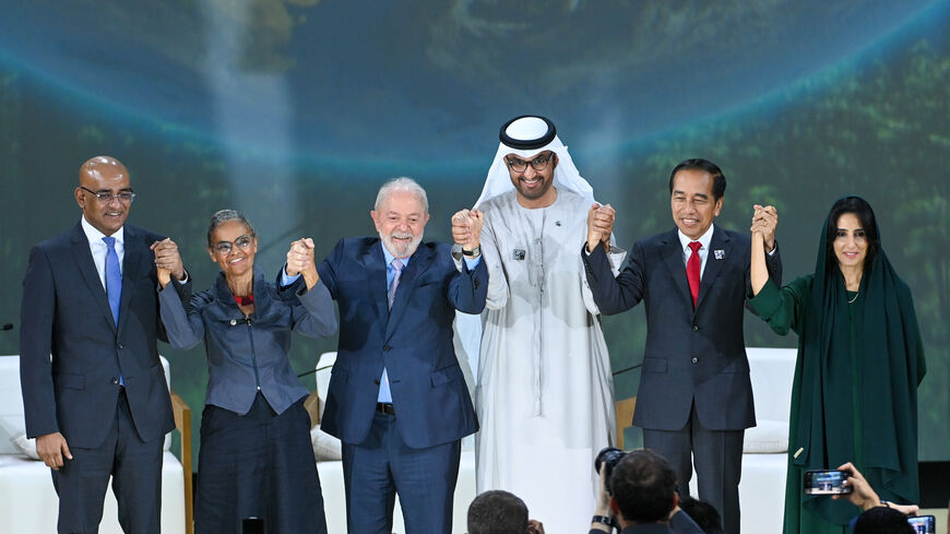 In this handout image supplied by COP28, Luiz Inácio Lula da Silva (L3), President of the Federative Republic of Brazil and Marina Silva (L2), Minister of the Environment, Joko Widodo (R2), President of the Republic of Indonesia, H.E Razan Al Mubarak (R1), President of the International Union for Conservation of Nature and Climate Change of Brazil and His Excellency Dr. Sultan Al Jaber (R3), COP28 President during the Nature Season at Al Waha Theatre during day two of the high-level segment of the UNFCCC CO