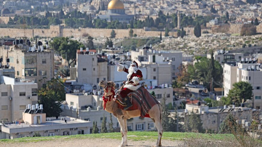 Palestinian Issa Kassissieh, dressed as Santa Claus.