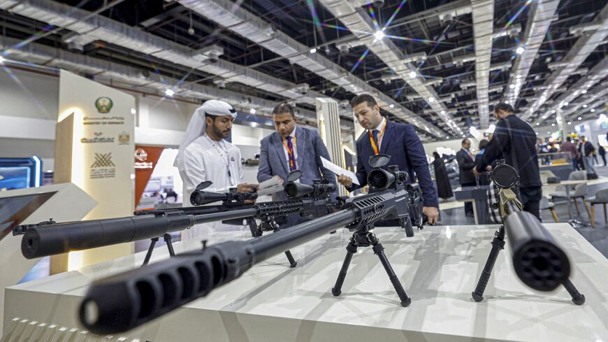 Visitors inspect sniper rifles during the opening day of Egypt Defence Expo (EDEX-2023) at the Cairo International Exhibition Center, Dec. 4, 2023.