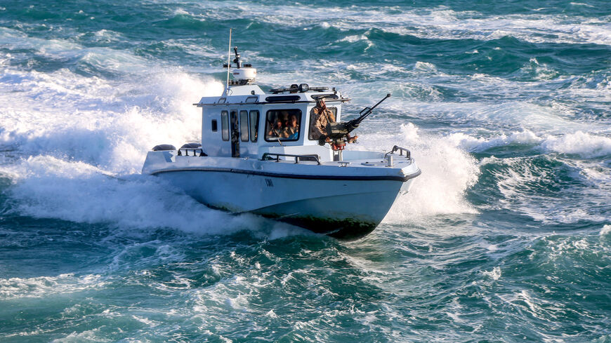 Yemeni coastguard members loyal to the internationally-recognised government ride in a patrol boat cruising in the Red Sea off of the government-held town of Mokha in the western Taiz province, close to the strategic Bab al-Mandab Strait, on December 12, 2023. (Photo by Khaled Ziad / AFP) (Photo by KHALED ZIAD/AFP via Getty Images)