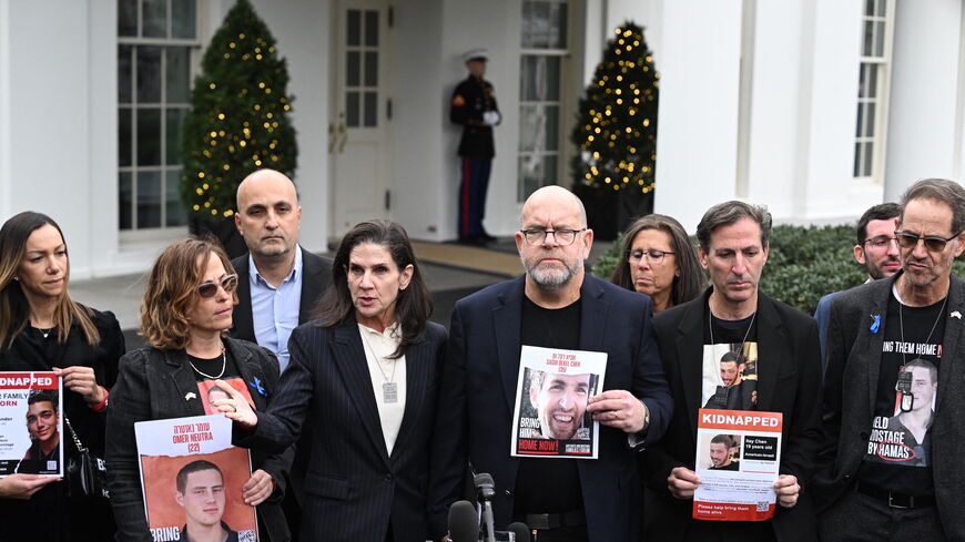Family members of American hostages held by Hamas speak to the press outside the White House in Washington, D.C., on Dec. 13, 2023, after a meeting with US President Joe Biden. 