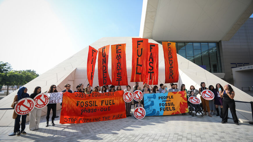 DUBAI, UNITED ARAB EMIRATES - DECEMBER 13: Activists stage a protest on day thirteen of the UNFCCC COP28 Climate Conference on December 13, 2023 in Dubai, United Arab Emirates. The conference has gone into an extra day as delegations continue to negotiate over the wording of the final agreement. The COP28, which was originally scheduled to run from November 30 through December 12, has brought together stakeholders, including international heads of state and other leaders, scientists, environmentalists, indi