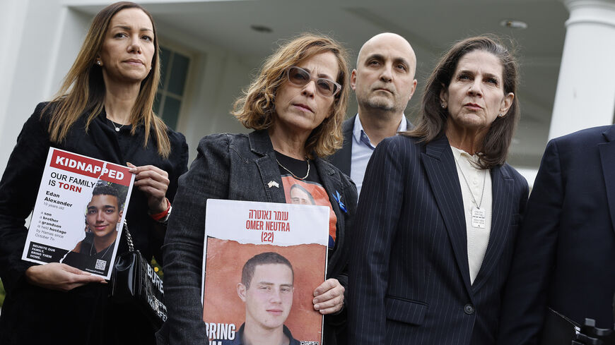 Family members of Americans who were taken hostage by Hamas during the terrorist attacks in Israel on Oct. 7, including (L-R) Yael Alexander, Orna Neutra, Adi Alexander and Liz Naftali, talk to reporters outside the West Wing of the White House on Dec. 13, 2023 in Washington, D.C.