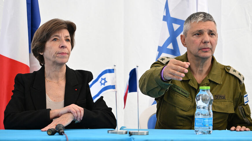 French Foreign and European Affairs Minister Catherine Colonna (L) and spokesperson of the Israeli army Col. Olivier Rafowitcz speak to the press as they visit the Shura army base near Ramle, Israel, Dec. 17, 2023.