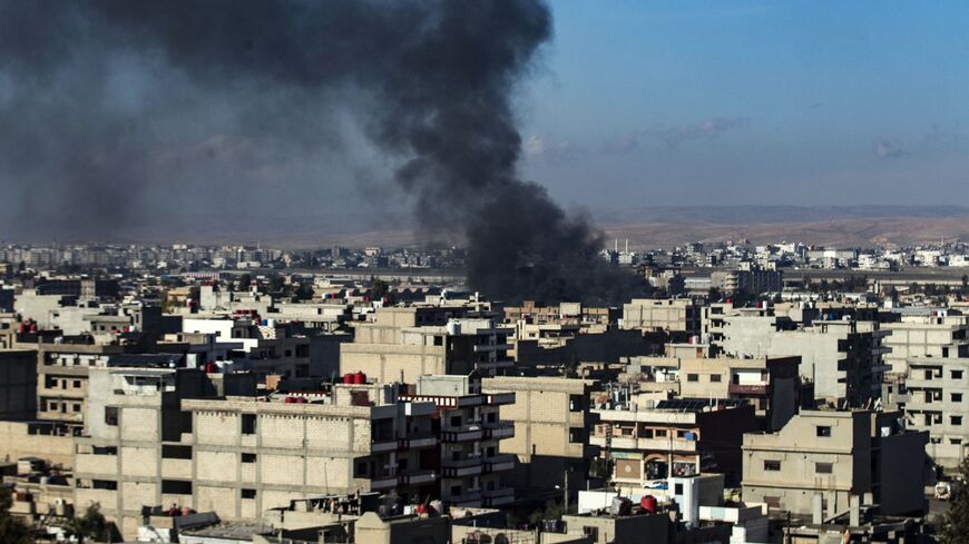 Smokes billows in Qamishli in northeastern Syria close to the Turkish border on Dec. 25, 2023.