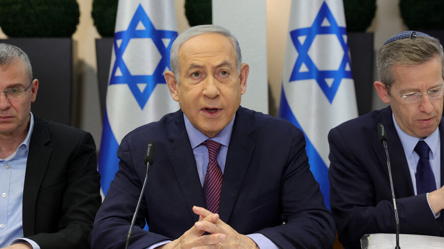 Israeli Prime Minister Benjamin Netanyahu (C) chairs a Cabinet meeting at the Kirya, which houses the Israeli Ministry of Defence, in Tel Aviv on December 31, 2023. Netanyahu said Israel displayed unparalleled "morality" in the Gaza war and rejected South Africa's charge that it was committing "genocidal" acts in the Palestinian territory