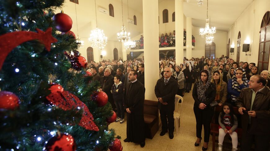 Assyrian Christians from Iraq, Syria and Lebanon attend a Christmas mass at Saint Georges church in an eastern Beirut suburb on Dec. 25, 2014. 