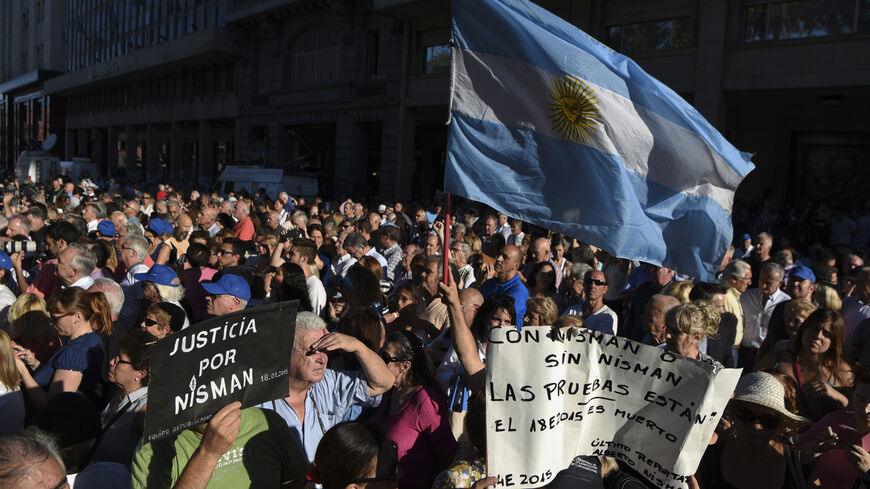 Activists take part in a ceremony marking the second anniversary of the controversial death of Argentinian prosecutor Alberto Nisman on January 18, 2017 in Buenos Aires. Nisman died in mysterious circumstances in January 18, 2015, after accusing Argentina's then president, Cristina Fernandez de Kirchner, of obstructing his investigation of a 1994 bombing at a Buenos Aires Jewish center. / AFP / EITAN ABRAMOVICH (Photo credit should read EITAN ABRAMOVICH/AFP via Getty Images)