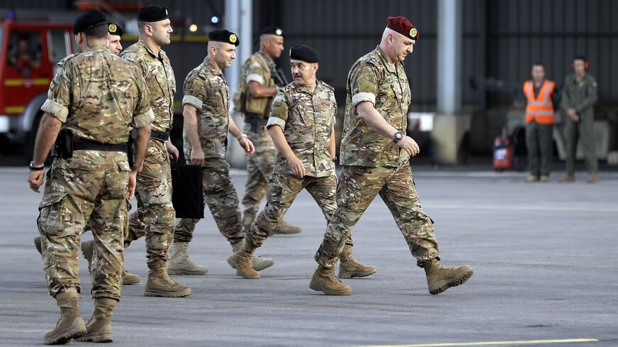 Gen. Joseph Aoun (R), Lebanese Army chief of staff, arrives at the Hamat airbase, north of Beirut, June 12, 2018.