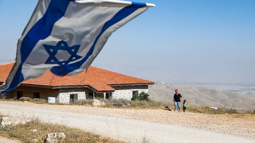 An Israeli flag flies near the settlement of Itamar in the occupied West Bank