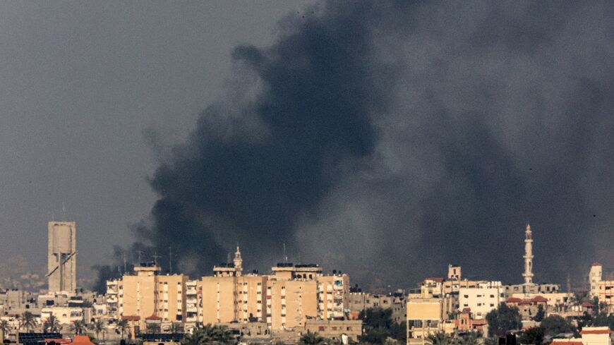 Smoke billows over Khan Yunis in the southern Gaza Strip during Israeli bombardment 