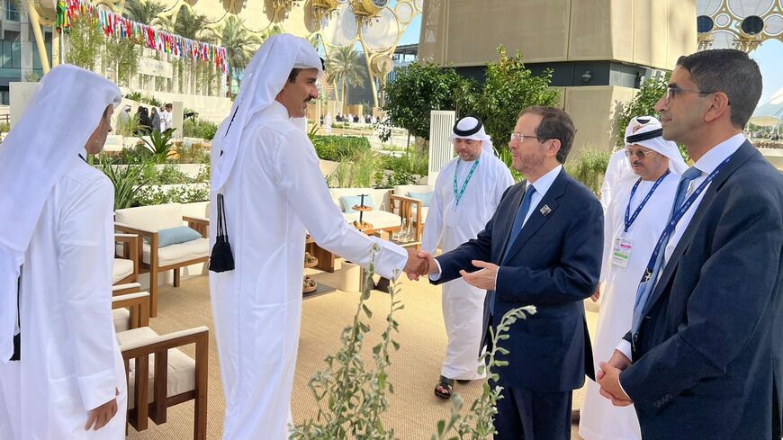 Israeli President Isaac Herzog meets with Qatar’s Emir Tamim bin Hamad Al Thani at the COP28 UN climate conference in Dubai, Dec. 1, 2023.