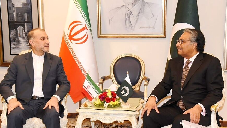 Pakistan Foreign Minister Jalil Abbas Jilani (right) with his Iranian counterpart Hossein Amir-Abdollahian in a Pakistan government handout photo