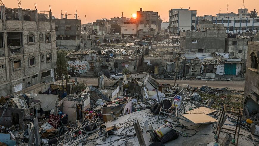 The sun rises above the Rafah refugee camp in the southern Gaza Strip 