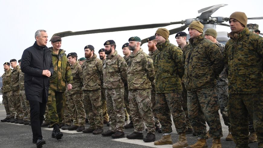 NATO Secretary General Jens Stoltenberg with  British soldiers during a NATO exercise in 2022