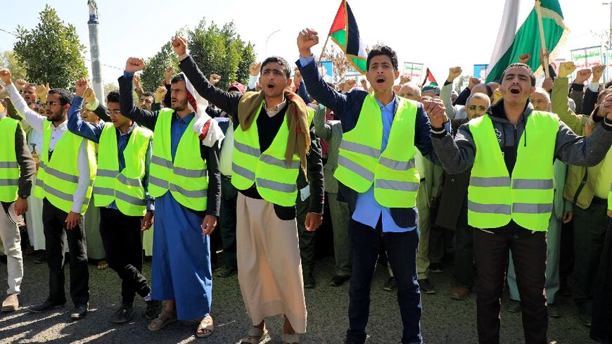 Yemenis wave Palestinian flags as they chant anti-Israel and anti-US slogans during a protest in solidarity with the Palestinian people in the Huthi-controlled capital Sanaa
