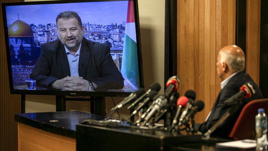 Senior Fatah official Jibril Rajoub, in the West Bank city of Ramallah, attends by video conference a meeting with deputy Hamas chief Saleh Arouri (on screen from Beirut) discussing Israel's plan to annex parts of the Israeli-occupied West Bank, on July 2, 2020. (Photo by ABBAS MOMANI / AFP) (Photo by ABBAS MOMANI/AFP via Getty Images)