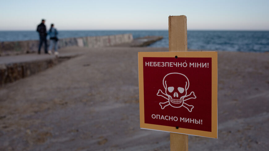 ODESSA, UKRAINE - APRIL 25: A view of the sign which reads "Caution: mines" on the beach on April 25, 2022 in Odessa, Ukraine. Ukrainian forces, as well as civilian Odessans, remain on guard against a potential Russian advance on this historic port city, whose capture could help give Russia control of Ukraine's southern coast. But given Russia's setbacks in this two-month-long war, including the sinking of its Black Sea Fleet's flagship Moskva, analysts regard a full-scale attack on Odessa to be unlikely. (