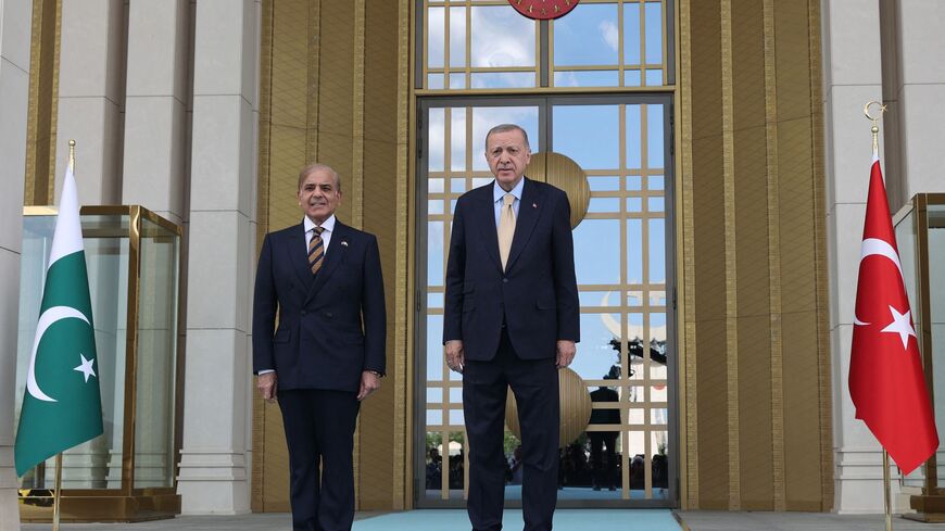 Turkish President Recep Tayyip Erdogan (R) welcomes Prime Minister of Pakistan Shehbaz Sharif as they pose upon his arrival during an official ceremony at the Presidential Complex in Ankara, Turkey on June 1, 2022. (Photo by Adem ALTAN / AFP) (Photo by ADEM ALTAN/AFP via Getty Images)
