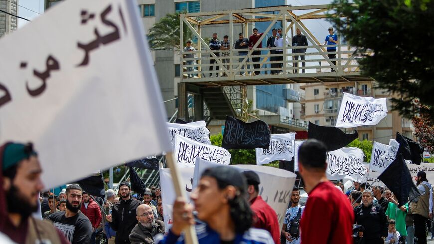 Members of the radical Islamist movement "Hizb ut-Tahrir" protest in the northern Lebanese port city of Tripoli, on April 28, 2023, against the deportation of Syrian refugees.