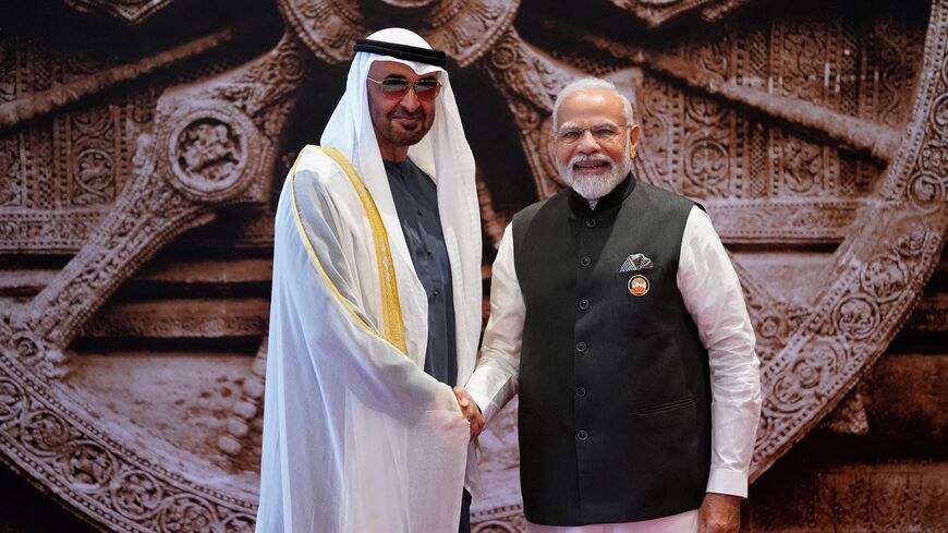India's Prime Minister Narendra Modi (R) shakes hand with United Arab Emirates President Sheikh Mohamed bin Zayed Al-Nahyan ahead of the G20 Leaders' Summit at the Bharat Mandapam in New Delhi on September 9, 2023. (Photo by Evan Vucci / POOL / AFP) (Photo by EVAN VUCCI/POOL/AFP via Getty Images)