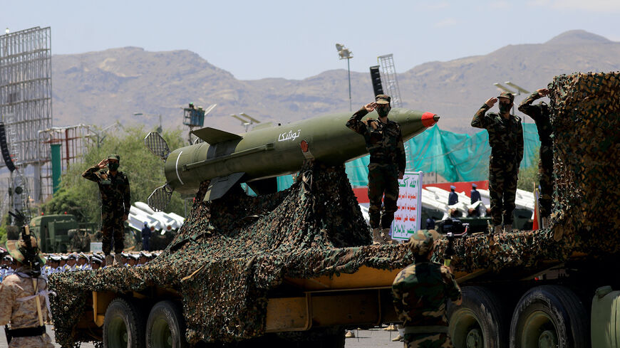 Houthi soldiers stand guard on a missile carrier during an official military parade marking the ninth anniversary of the Houthi takeover of the capital, Sanaa, on Sept. 21, 2023. 