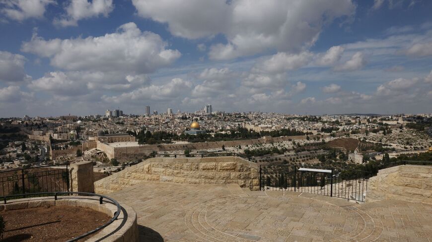 A photo taken on October 11, 2023 shows the empty Mount of Olives touristic site overlooking Jerusalem's Dome of the Rock (background), as the ferocious war between Israel and the Palestinian Hamas movement further south enters its fifth day. Hamas has branded its coordinated land, air and sea offensive against Israel that began on October 7 "Operation Al-Aqsa Flood". (Photo by AHMAD GHARABLI / AFP) (Photo by AHMAD GHARABLI/AFP via Getty Images)