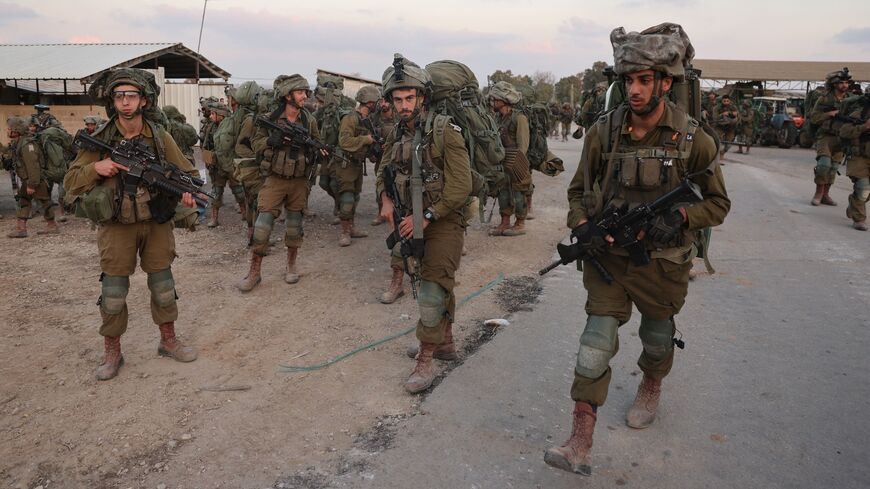 Israeli soldiers deploy at kibbutz Beeri near the border with Gaza, Oct. 11, 2023.