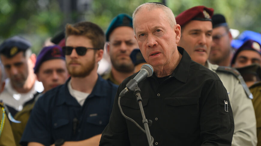 Israel's Minister of Defense Yoav Gallant speaks at the funeral for Col. Asaf Hamami, commander of Gaza Division's Southern Brigade, at the Kiryat Shaul cemetery, Tel Aviv, Israel, Dec. 4, 2023.