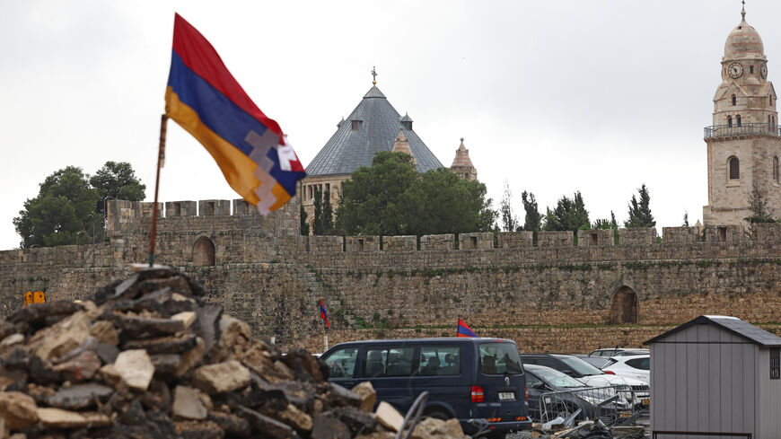A picture shows the Armenian car park in the Old City of Jerusalem on December 13, 2023. When bulldozers rolled into Jerusalem's Old City to start work on an Israeli settlement that would build a luxury hotel atop a fourth of the historic Armenian quarter, residents rapidly mobilised. Ever since the construction work began, Armenians have set up camp -- bringing tents, stoves, mattresses and a TV -- to a weeks-long sit-in to guard the land. Inside a tent, wooden planks patch up the holes left by constructio