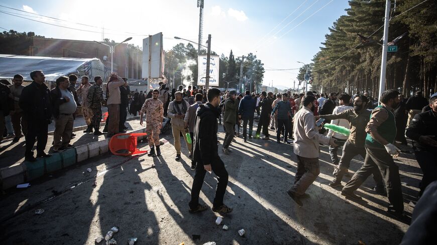 People disperse near the site where two explosions in quick succession struck a crowd marking the anniversary of the 2020 killing of Guards general Qasem Soleimani on Jan. 3, 2024.