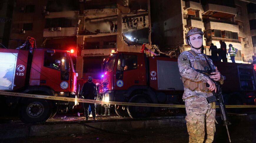 Soldiers of the Lebanese Army near the damaged building that was allegedly targeted by an Israeli drone strike on Jan. 2, 2024 in Dahiyeh, a suburb of Beirut, Lebanon. 
