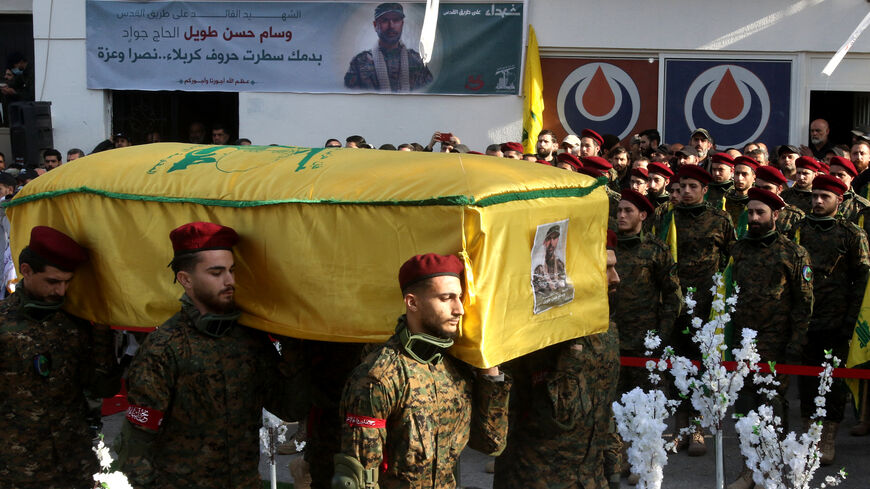 Hezbollah militants carry the coffin of slain Hezbollah military commander Wissam Tawil (Jawad) during his funeral in his hometown village of Khirbet Selm, south of Beirut on January 9, 2024. Hezbollah announced on January 8 the killing of a "commander" for the first time, naming him as Wissam Hassan Tawil. A security souce in Lebanon, requesting anonymity for security reasons, said Tawil "had a leading role in managing Hezbollah's operations in the south", and was killed there by an Israeli strike targetin