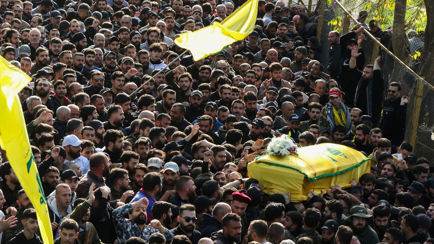Hezbollah fighters and supporters attend the funeral of slain Hezbollah military commander Wissam Tawil, also know as Jawad, in his hometown of Khirbet Selm, south of Beirut on January 9, 2024. Hezbollah announced on January 8 the killing of a "commander" for the first time, naming him as Wissam Hassan Tawil. A security souce in Lebanon, requesting anonymity for security reasons, said Tawil "had a leading role in managing Hezbollah's operations in the south", and was killed there by an Israeli strike target
