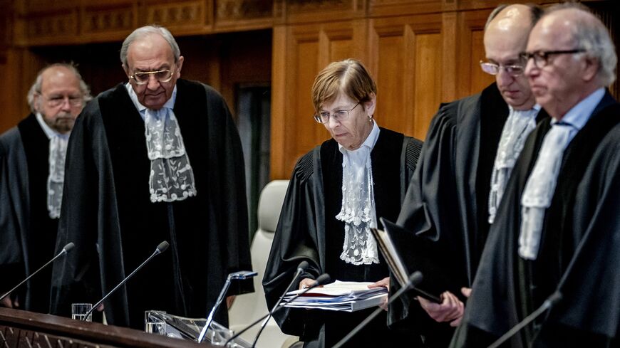 President Joan Donoghue (C), and other judges in the International Court of Justice (ICJ) take their seats prior to the hearing on the genocide case against Israel, brought by South Africa, in The Hague on Jan. 11, 2024.