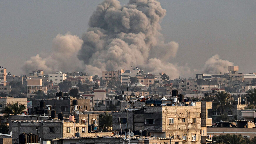 Smoke is seen billowing over Khan Yunis during Israeli bombardment, amid ongoing battles between Israel and Hamas, southern Gaza Strip, Jan. 15, 2024.